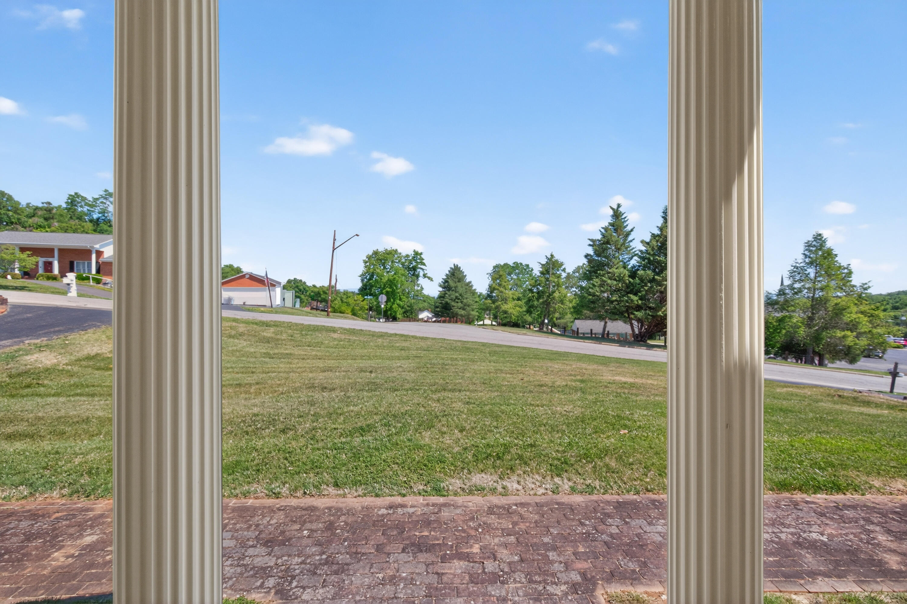 4322 Rosecrest Road Roanoke, VA 24018 - Photo 2 of 36 a view of a room with a floor to ceiling window and a yard