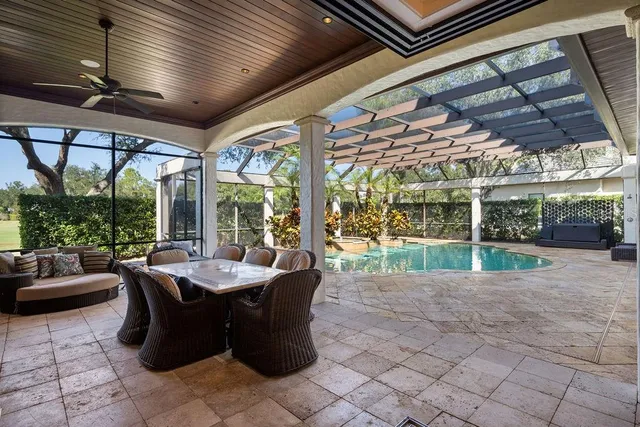 a view of a swimming pool with a patio and a patio