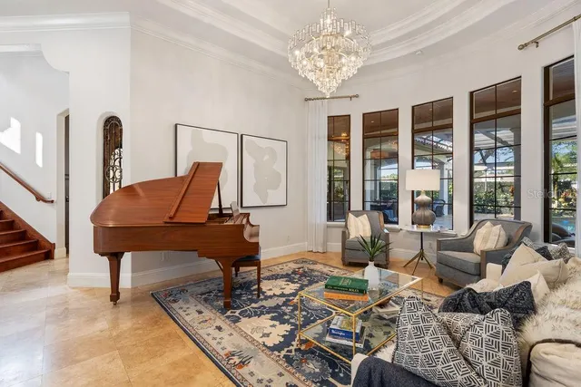 a view of a hallway with entryway furniture and livingroom view