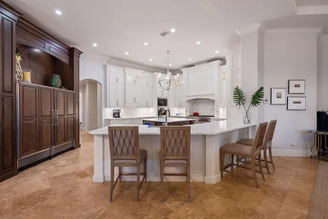a dining room with furniture window outside view and wooden floor