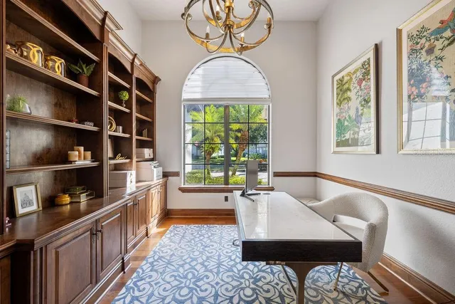 a spacious bedroom with a large bed and windows