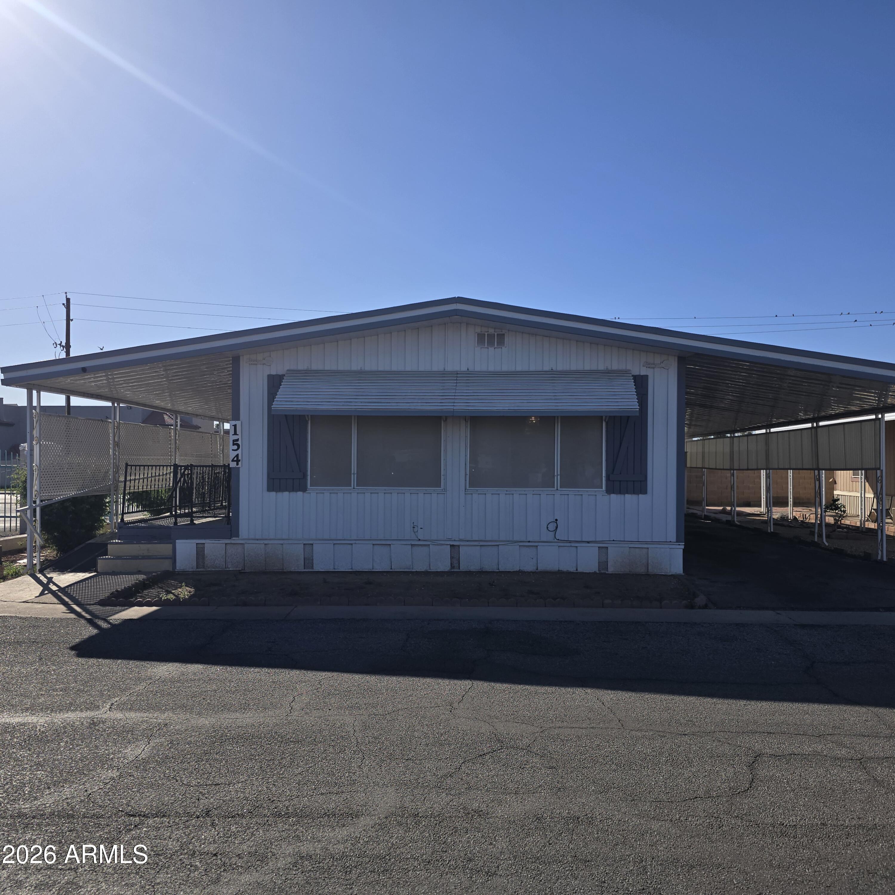 a view of building with car parked