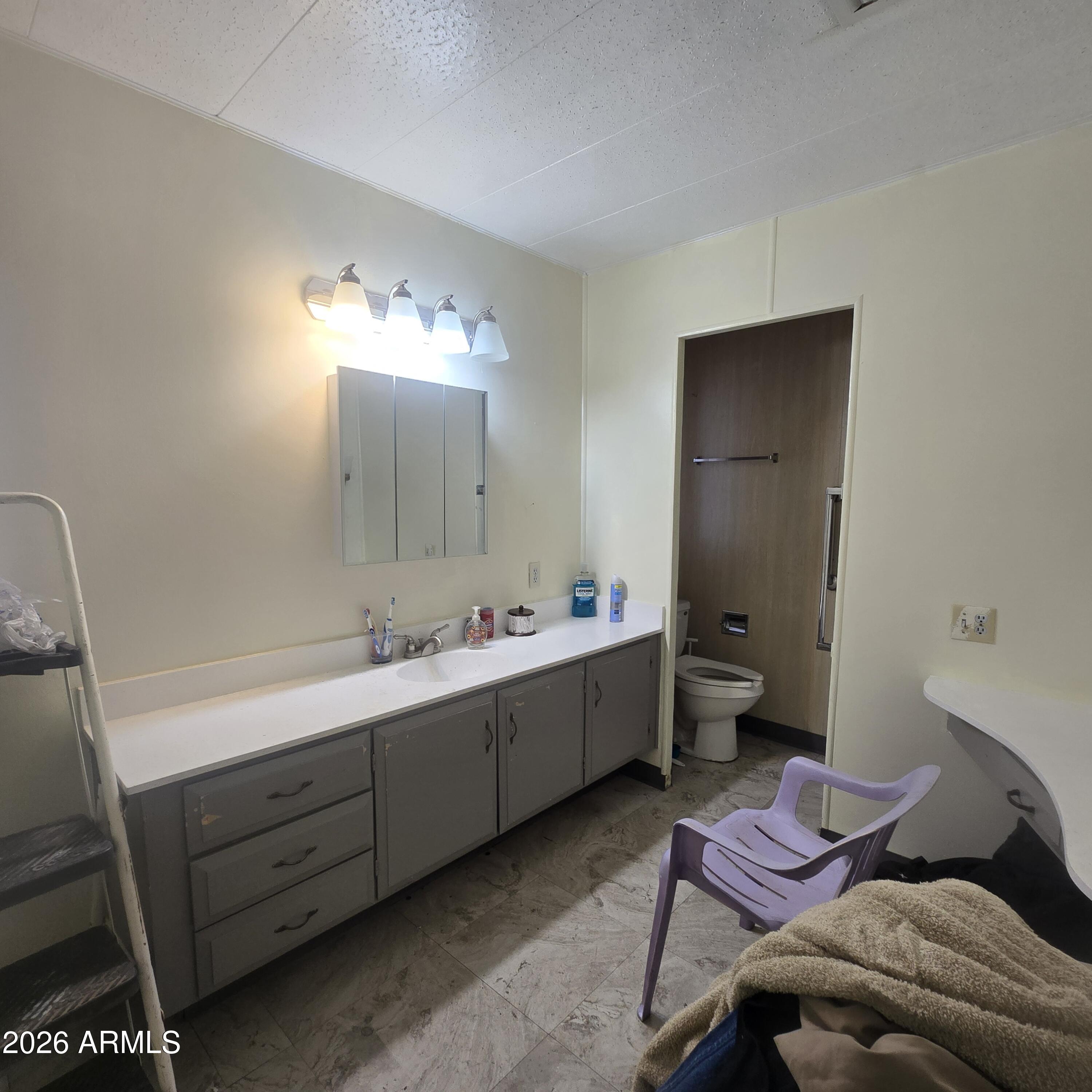 4800 West Ocotillo Road, Unit 154 Glendale, AZ 85301 - Photo 20 of 41 a spacious bathroom with a double vanity sink and a mirror