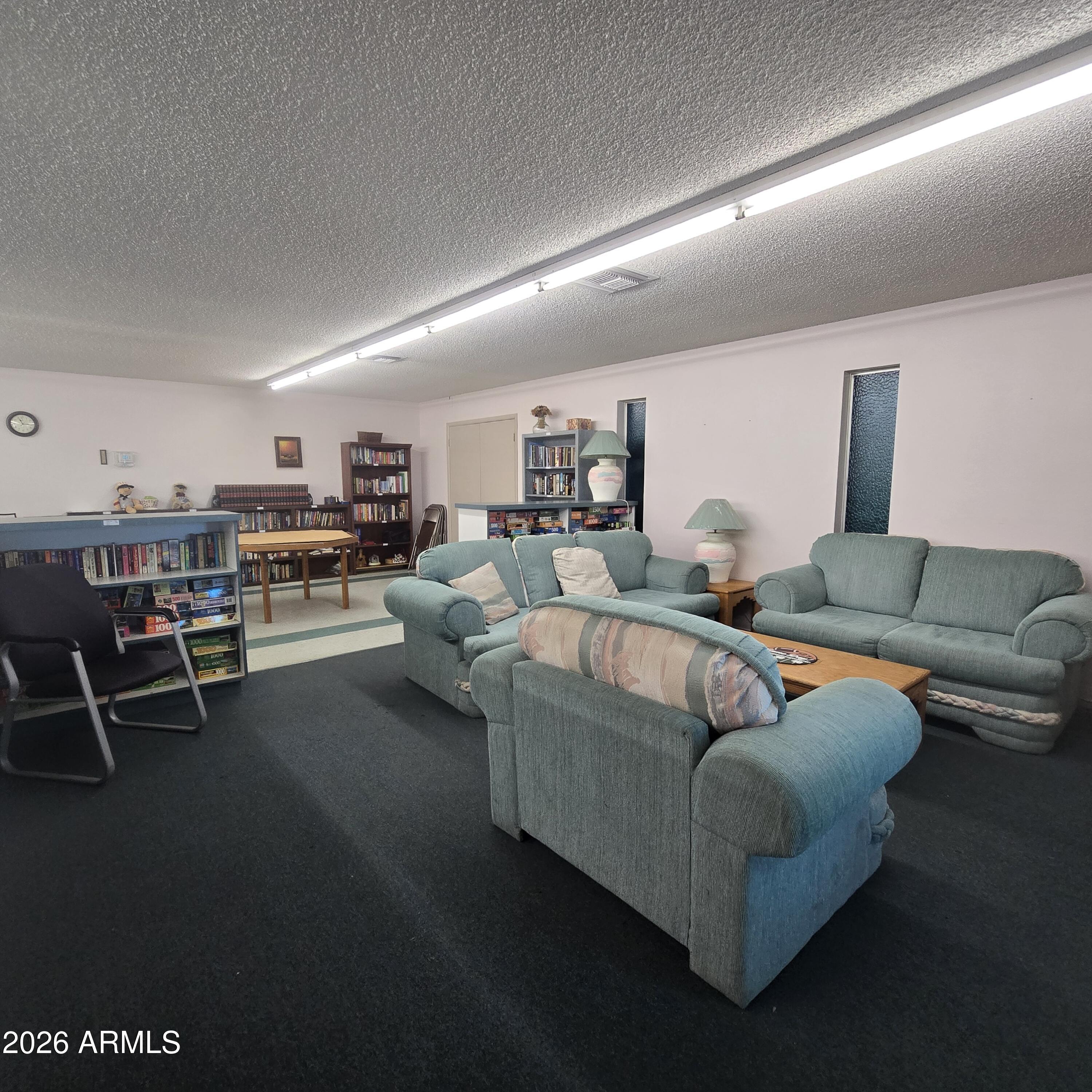 4800 West Ocotillo Road, Unit 154 Glendale, AZ 85301 - Photo 31 of 41 a living room with furniture and a table