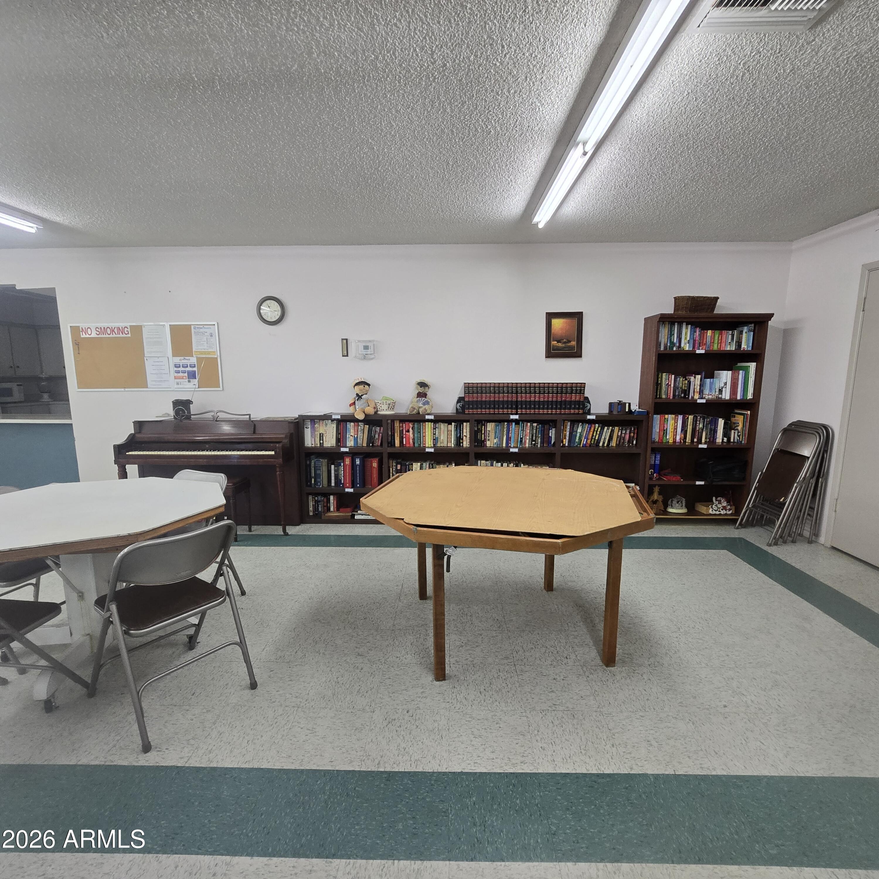 4800 West Ocotillo Road, Unit 154 Glendale, AZ 85301 - Photo 32 of 41 a living room with furniture a rug and a table