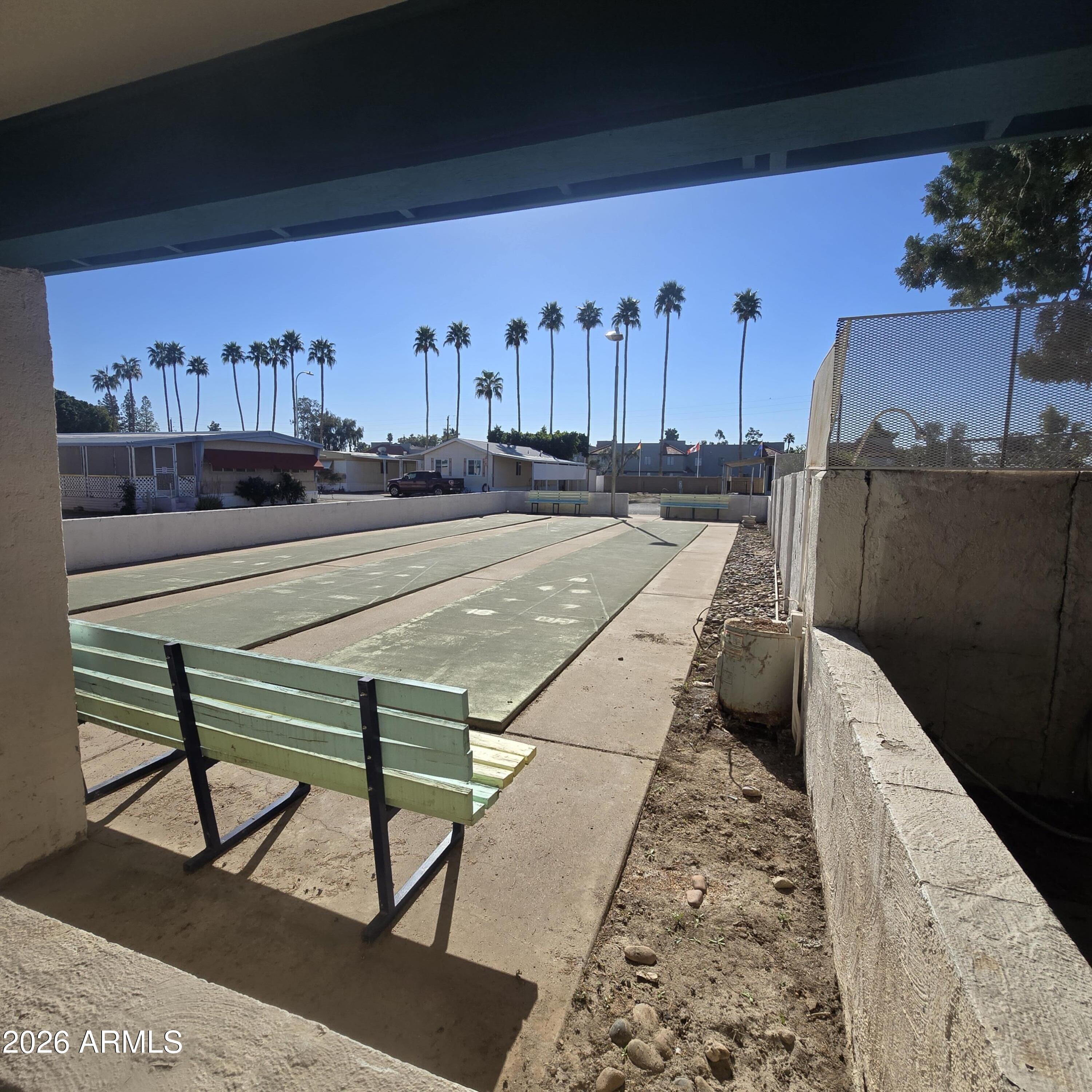 4800 West Ocotillo Road, Unit 154 Glendale, AZ 85301 - Photo 38 of 41 a view of a balcony with chairs and a potted plant