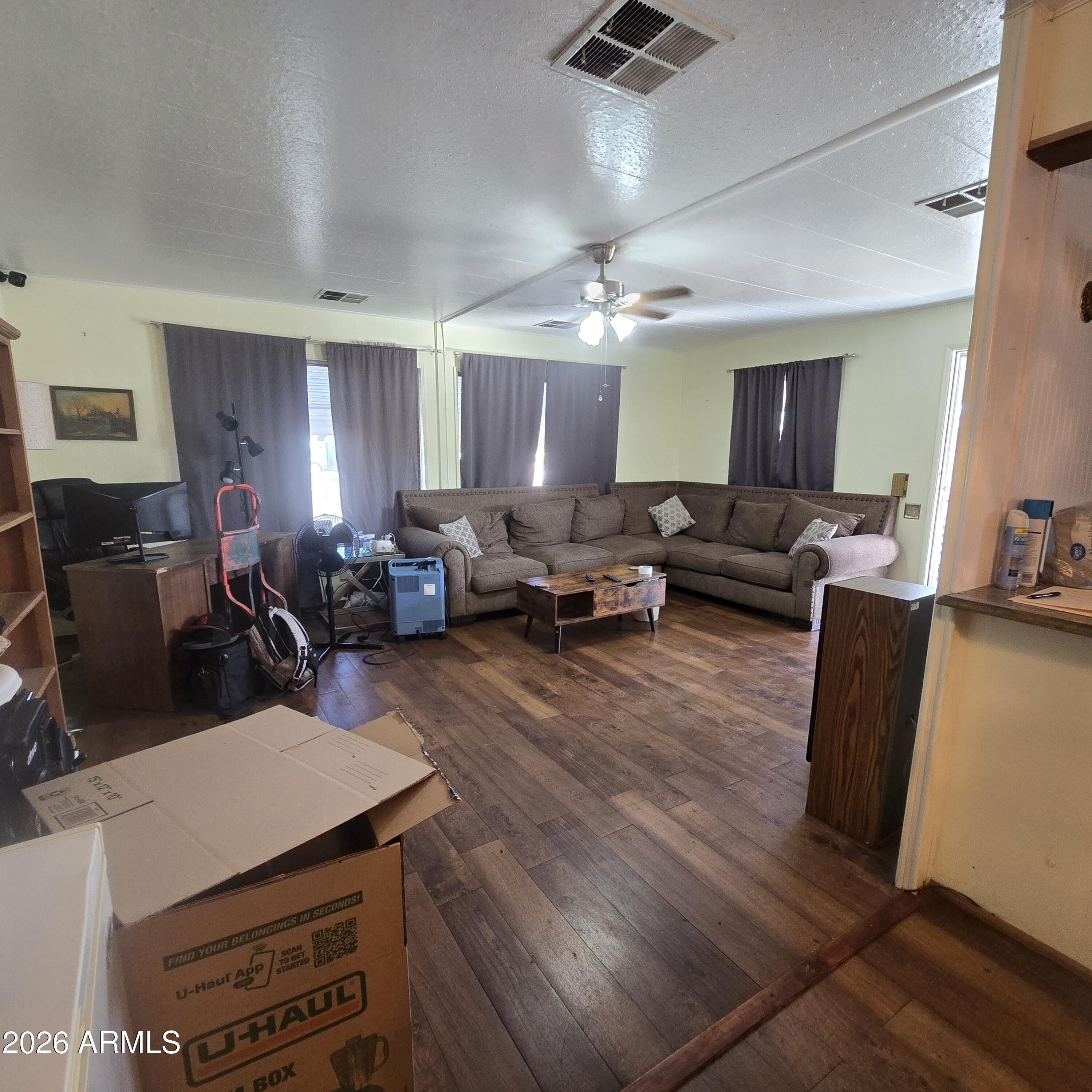 4800 West Ocotillo Road, Unit 154 Glendale, AZ 85301 - Photo 9 of 41 a living room with furniture a flat screen tv and a window