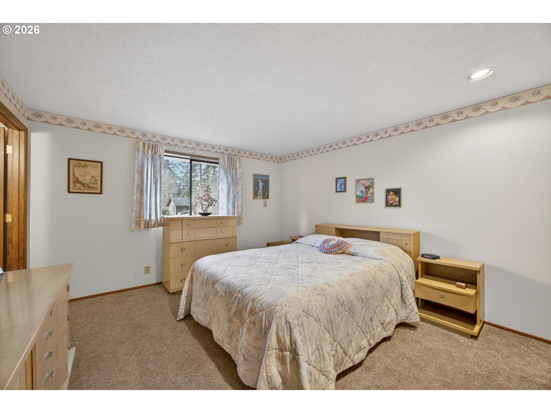 8050 Southwest 103rd Avenue Beaverton, OR 97008 - Photo 12 of 48 a bedroom with a bed and a night stand