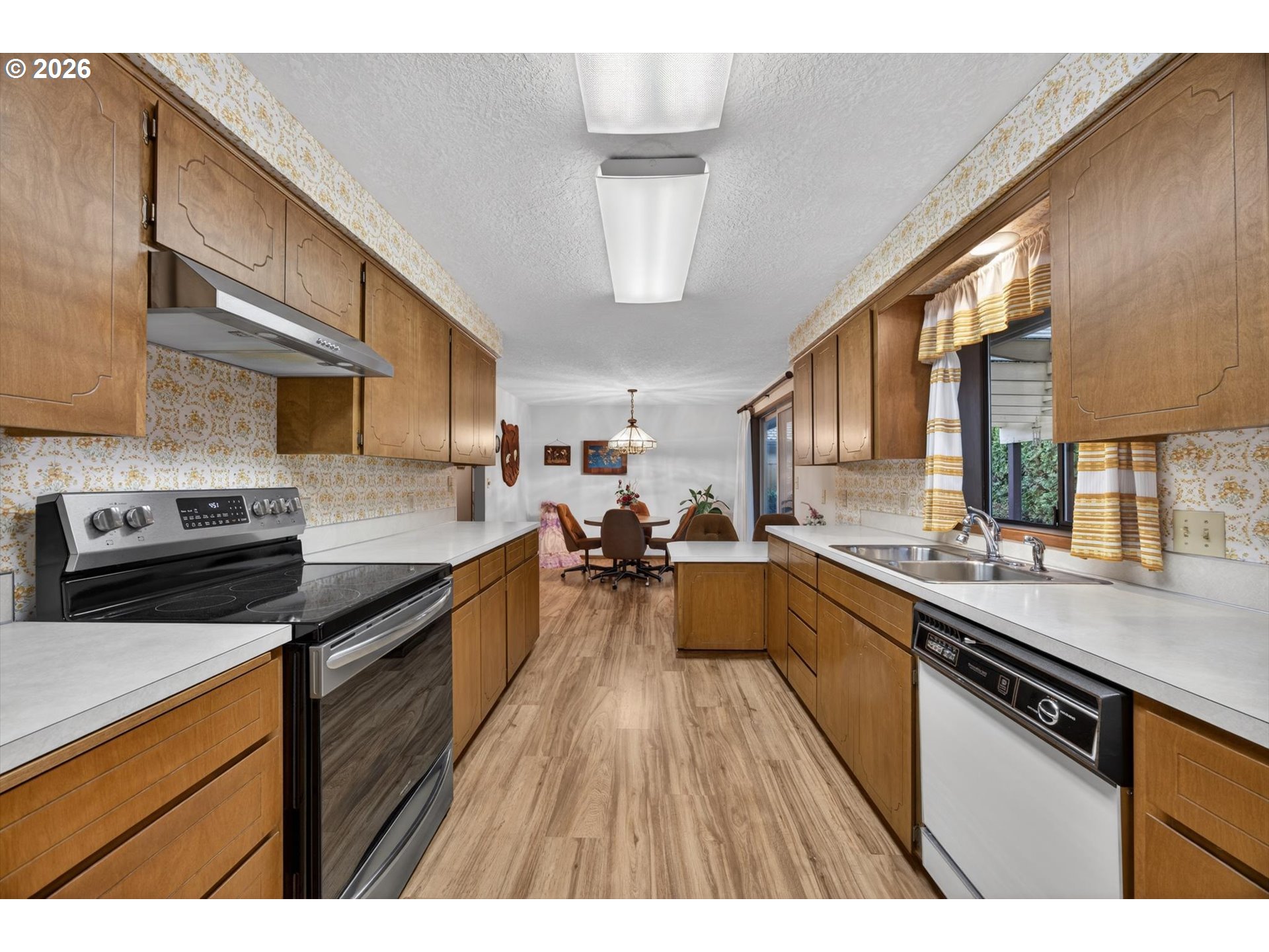 8050 Southwest 103rd Avenue Beaverton, OR 97008 - Photo 19 of 48 a kitchen with stainless steel appliances a sink dishwasher stove and oven