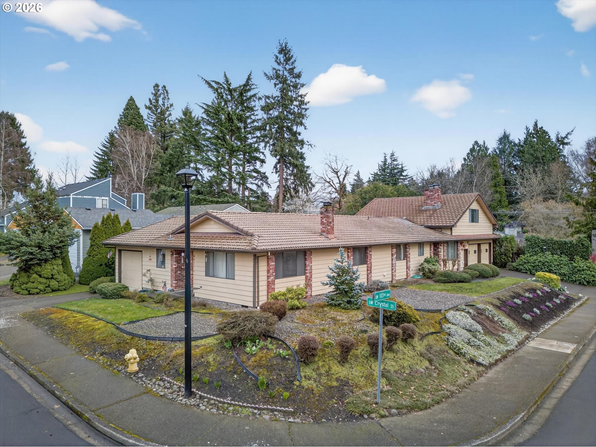 8050 Southwest 103rd Avenue Beaverton, OR 97008 - Photo 3 of 48 a front view of a house with garden