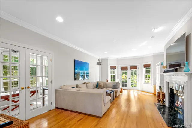 a living room with fireplace furniture and a flat screen tv
