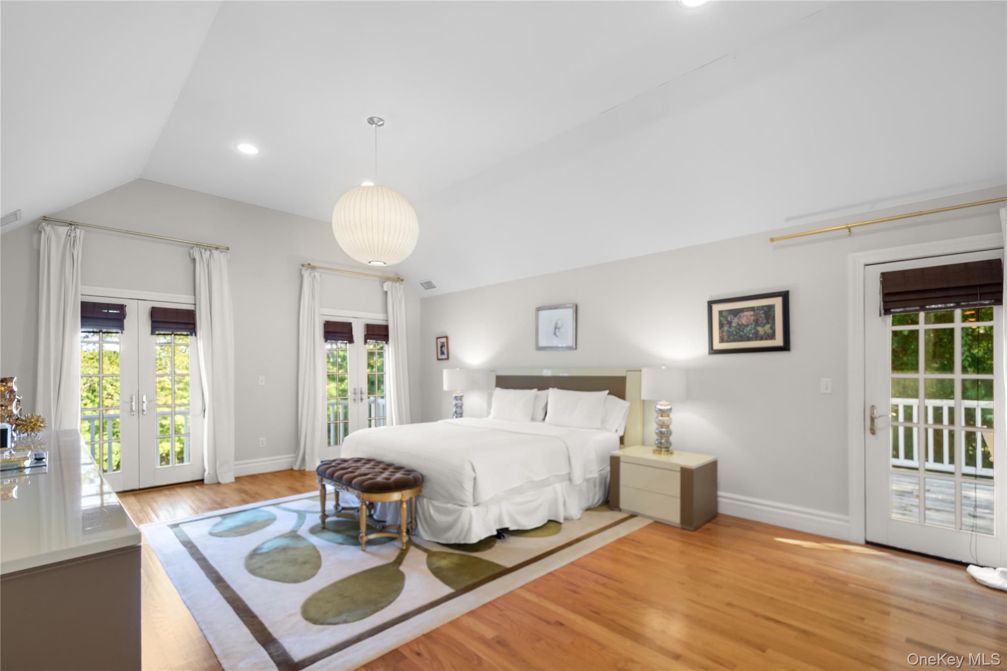 12 Fish Cove Road Southampton, NY 11968 - Photo 15 of 25 a bedroom with a bed and a table