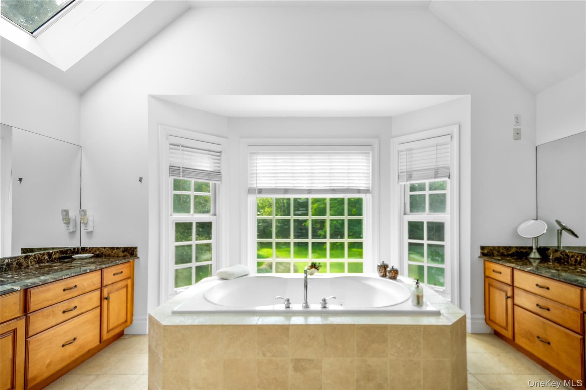 12 Fish Cove Road Southampton, NY 11968 - Photo 16 of 25 a large kitchen with granite countertop a sink and a large window