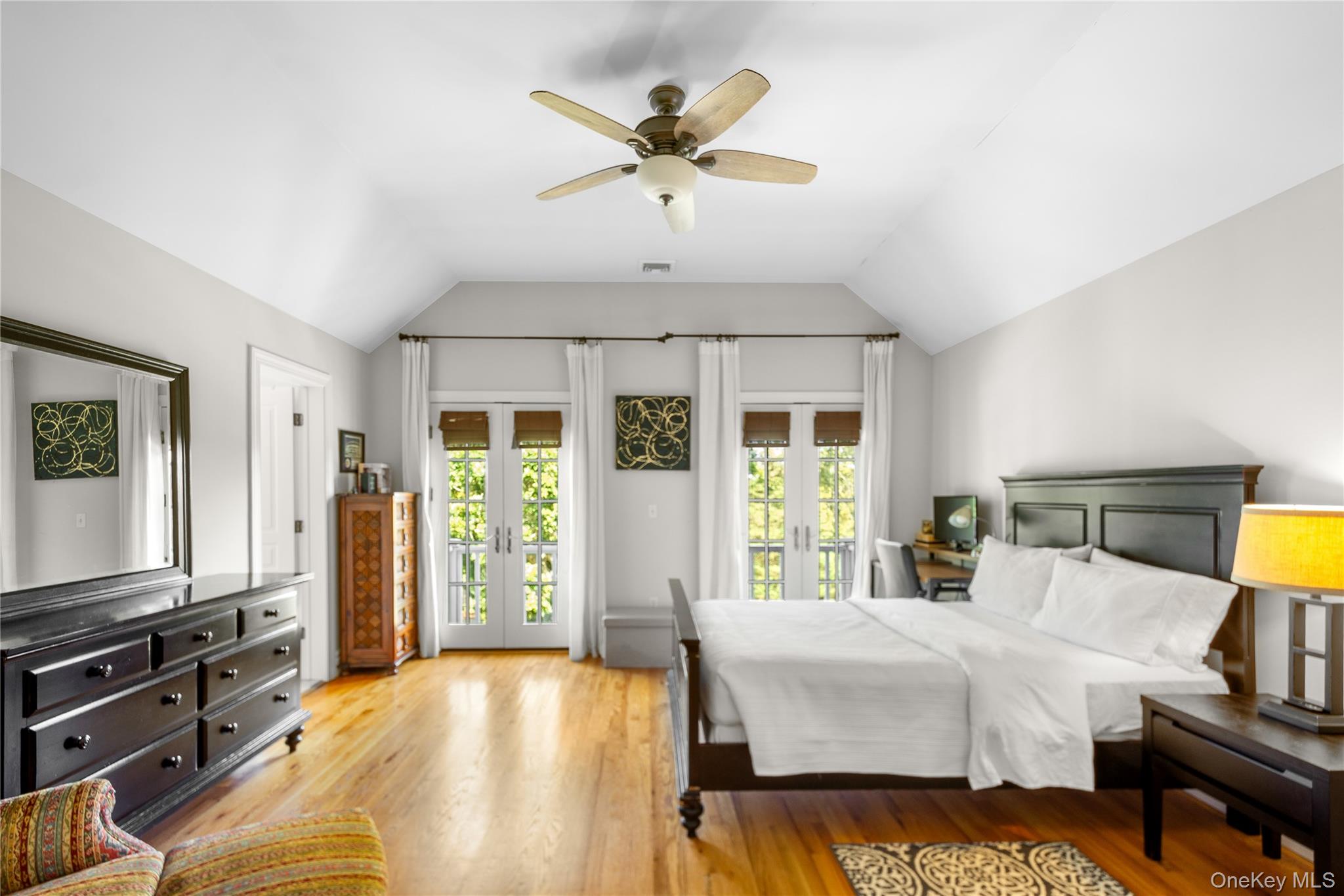 12 Fish Cove Road Southampton, NY 11968 - Photo 17 of 25 a bed room with a bed and a flat tv screen