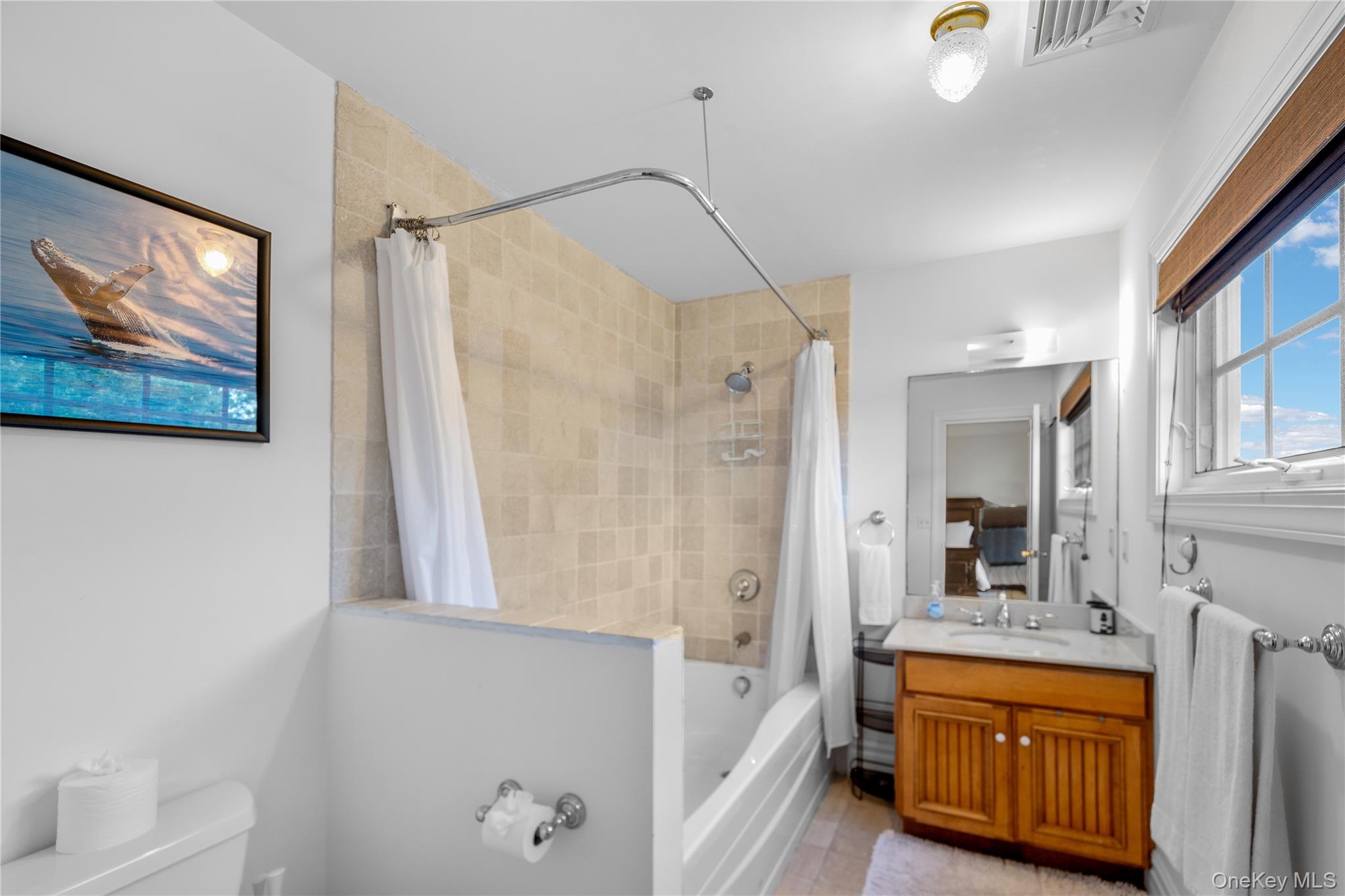 12 Fish Cove Road Southampton, NY 11968 - Photo 18 of 25 a spacious bathroom with a tub shower and sink