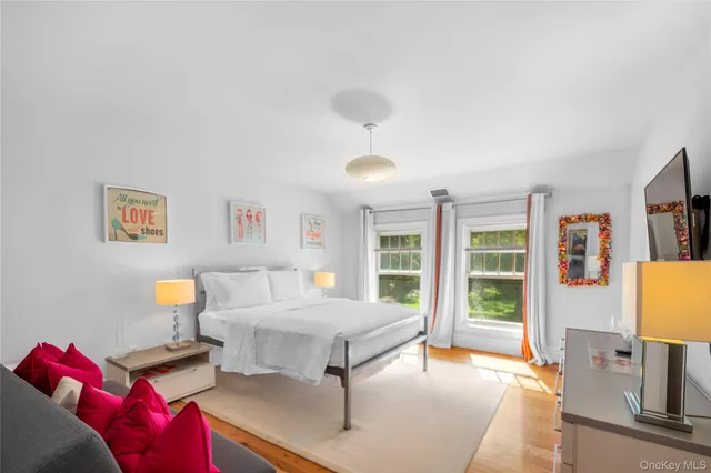 a bedroom with a large bed and a couch