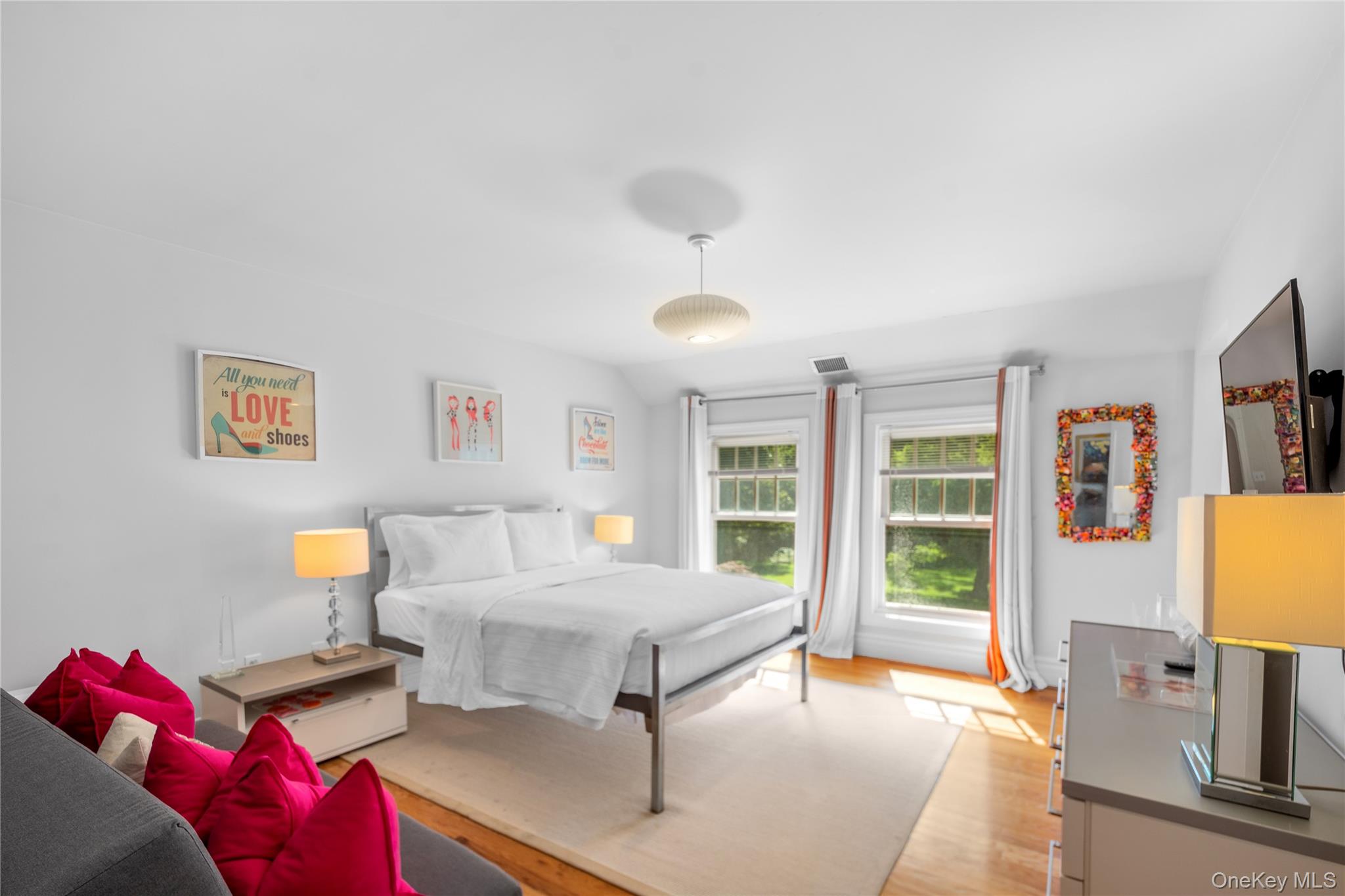 12 Fish Cove Road Southampton, NY 11968 - Photo 19 of 25 a bedroom with furniture and a window