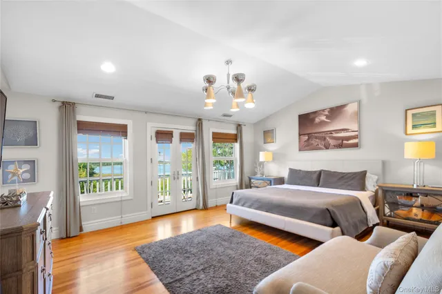 a view of backyard with outdoor seating and green space