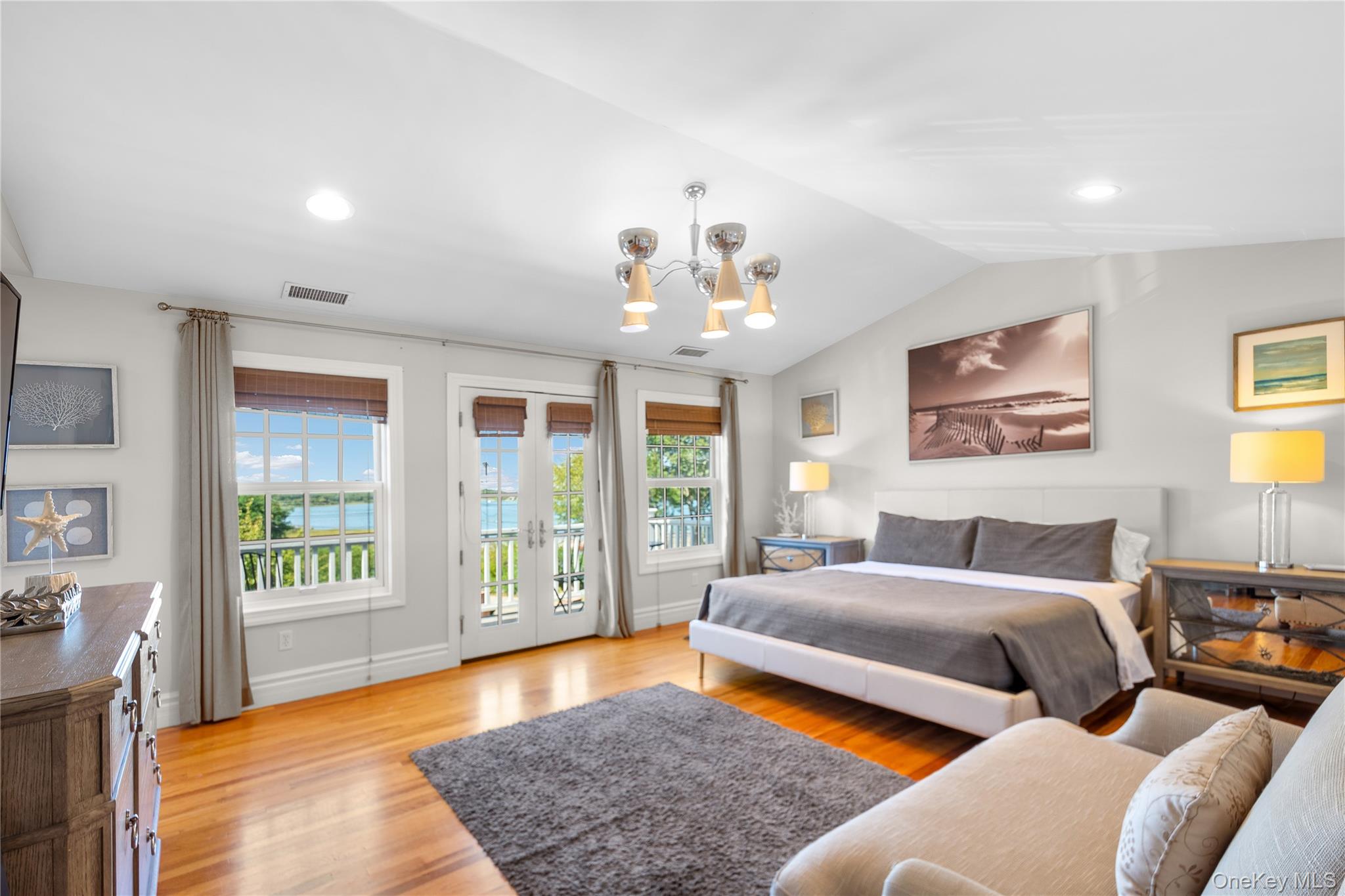 12 Fish Cove Road Southampton, NY 11968 - Photo 20 of 25 a bedroom with a large bed and a couch