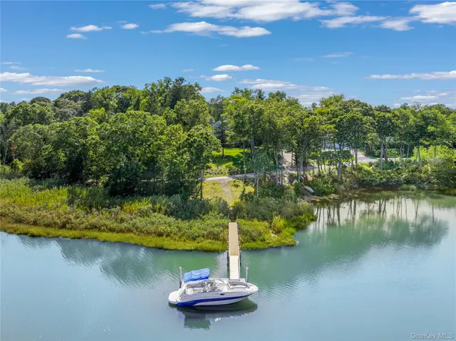 a view of a lake with a yard