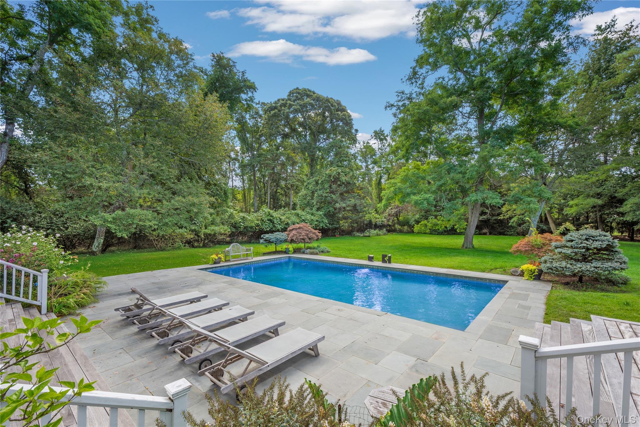 12 Fish Cove Road Southampton, NY 11968 - Photo 23 of 25 a view of a backyard with swimming pool