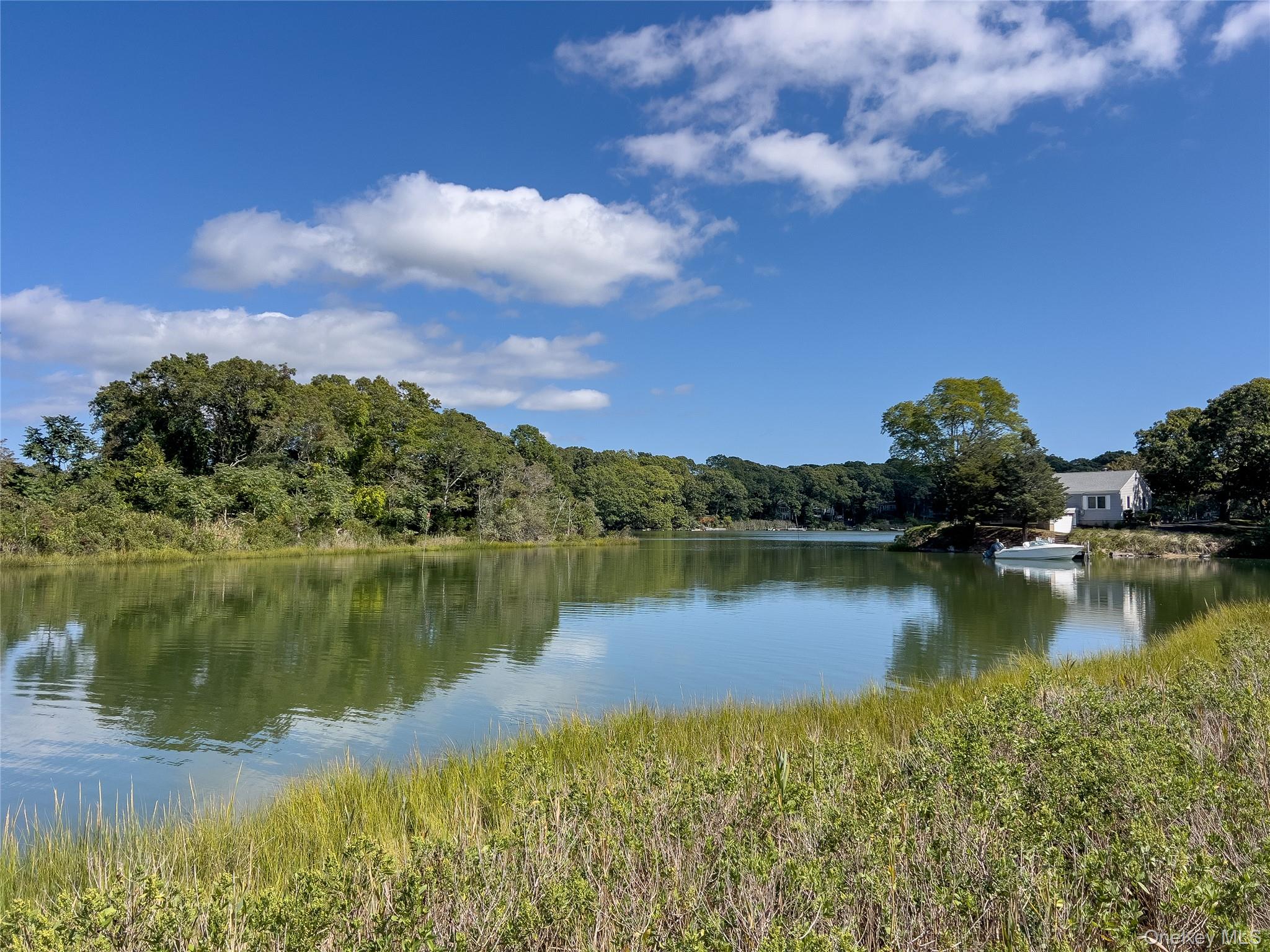 12 Fish Cove Road Southampton, NY 11968 - Photo 24 of 25 a view of a lake in between the city and lake