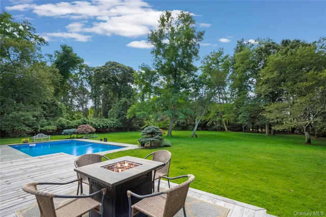 a view of a chairs and table in a garden