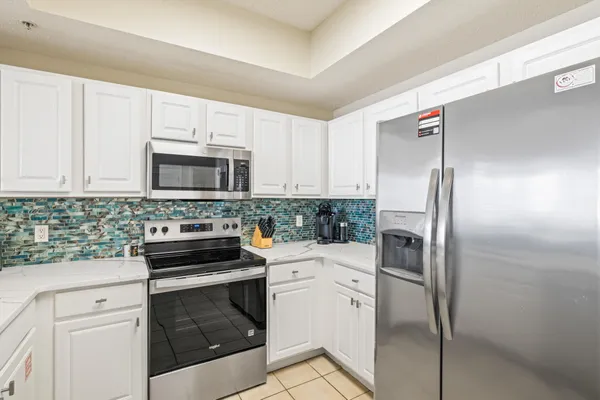 a kitchen with a stove microwave and refrigerator