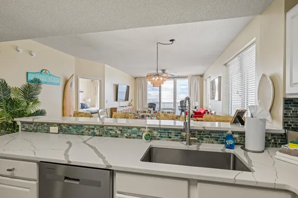 a kitchen with a sink and a refrigerator