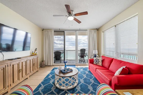 a living room with furniture and a large window