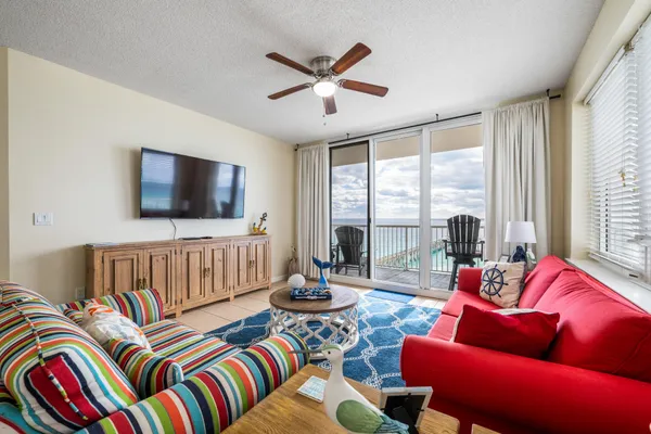 a living room with furniture and a flat screen tv