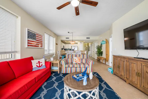 a living room with furniture and a flat screen tv