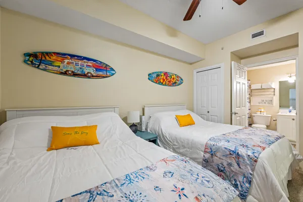 a bedroom with two beds and a couch