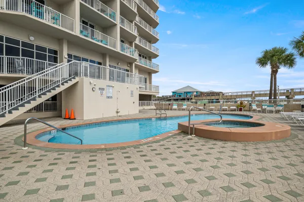 a view of a swimming pool with a lounge chairs