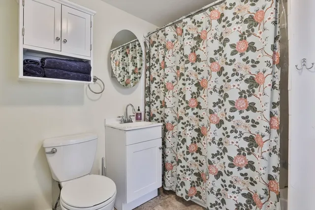 a bathroom with a toilet and a sink