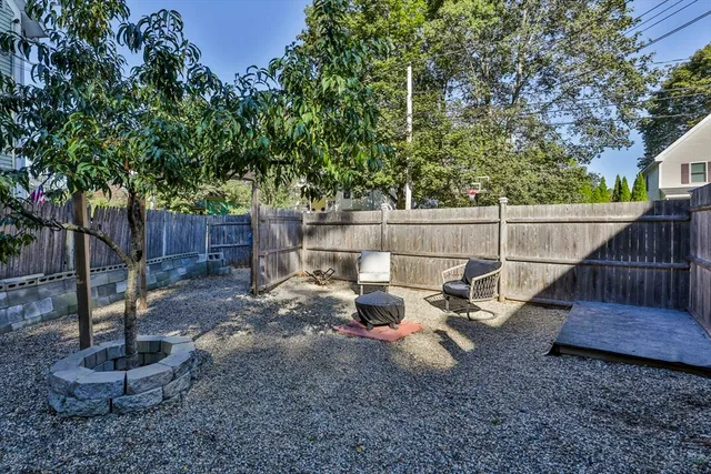 a view of a backyard with sitting area