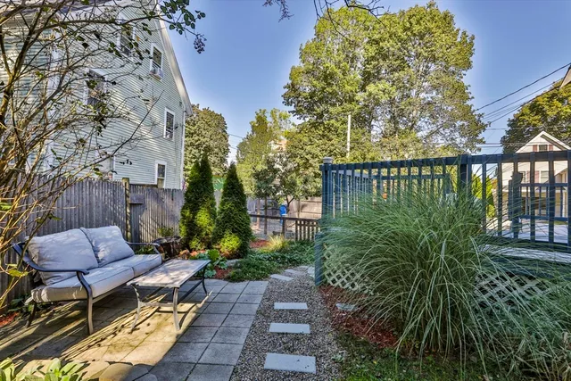 a view of a chairs and table in the balcony