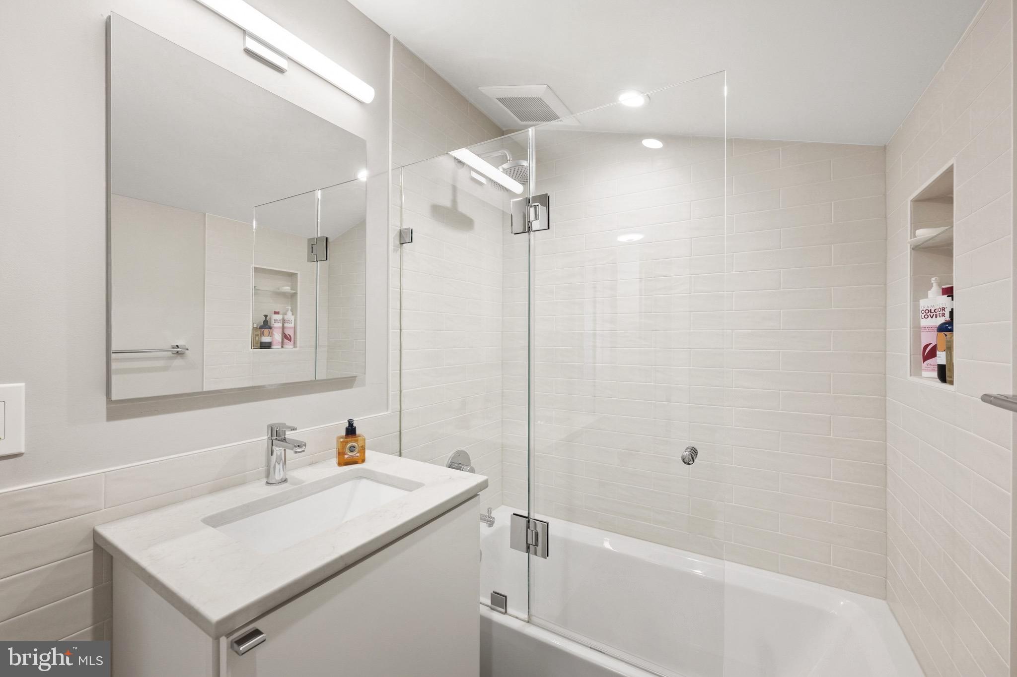 7409 Ridgewood Avenue Chevy Chase, MD 20815 - Photo 22 of 29 Renovated hall bath