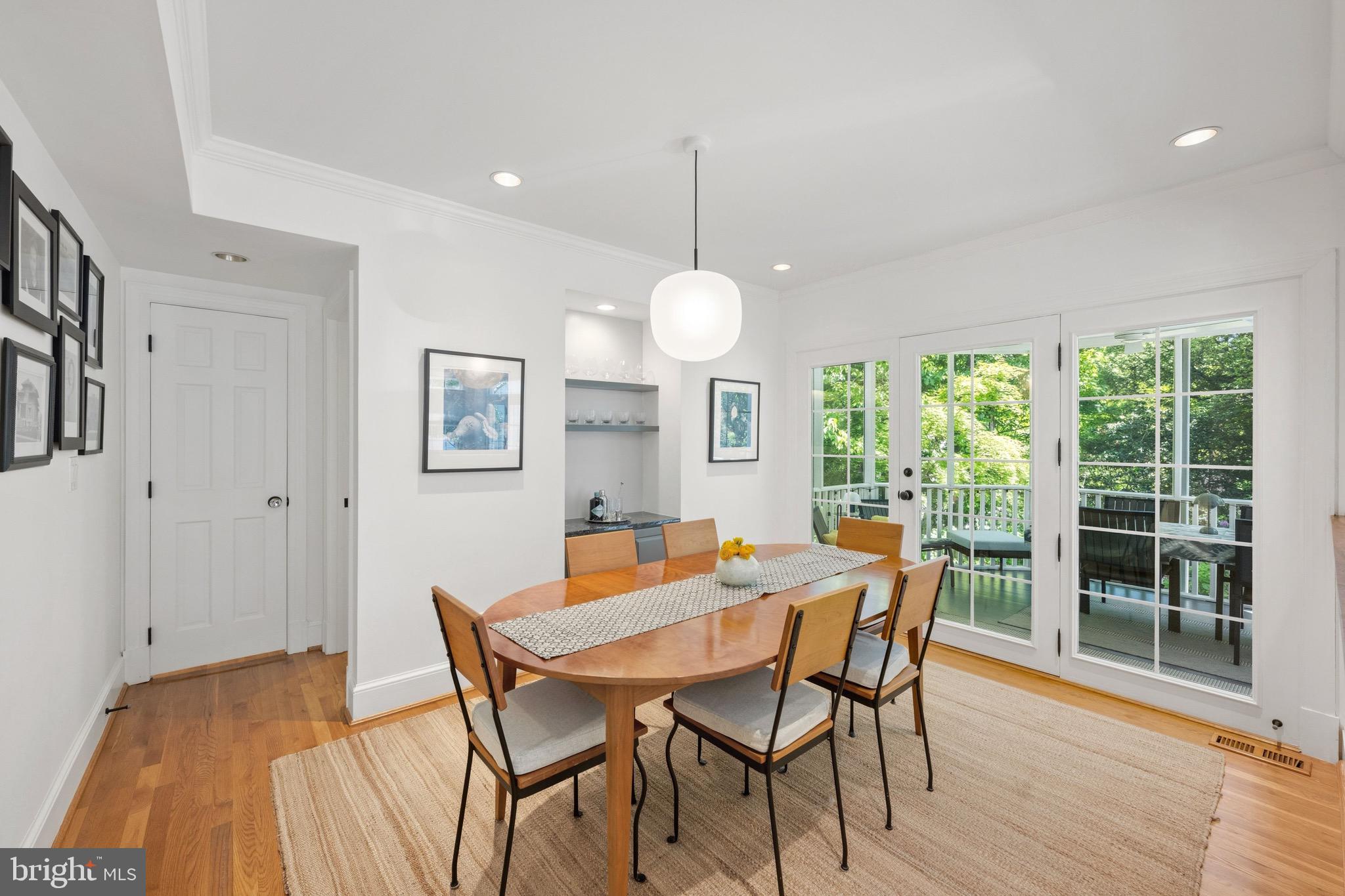7409 Ridgewood Avenue Chevy Chase, MD 20815 - Photo 7 of 29 Dining room opens to screened porch