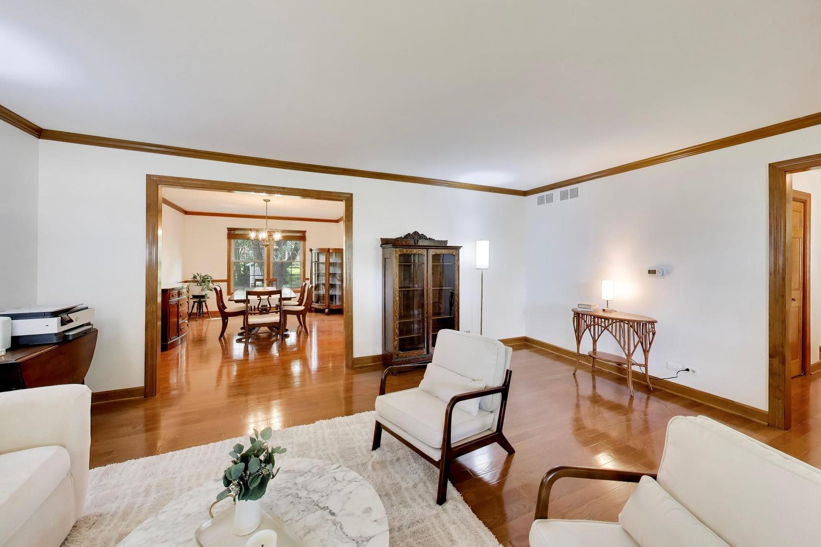 1528 Sequoia Road Naperville, IL 60540 - Photo 7 of 34 a living room with furniture and wooden floor