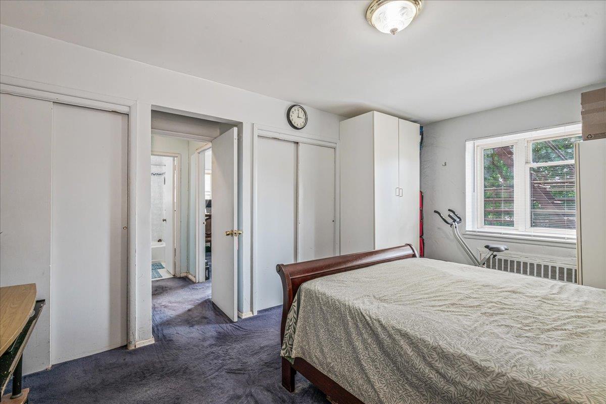 144-55 Melbourne Avenue, Unit 2E Queens, NY 11367 - Photo 12 of 21 a bedroom with a bed and a window