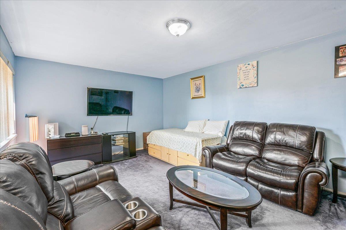 144-55 Melbourne Avenue, Unit 2E Queens, NY 11367 - Photo 7 of 21 a living room with furniture