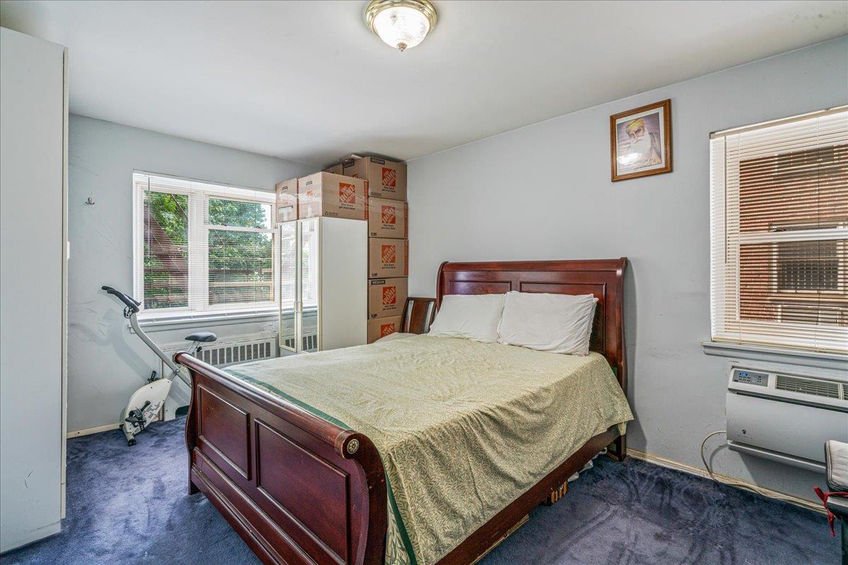 144-55 Melbourne Avenue, Unit 2E Queens, NY 11367 - Photo 10 of 21 a bedroom with a bed and a window