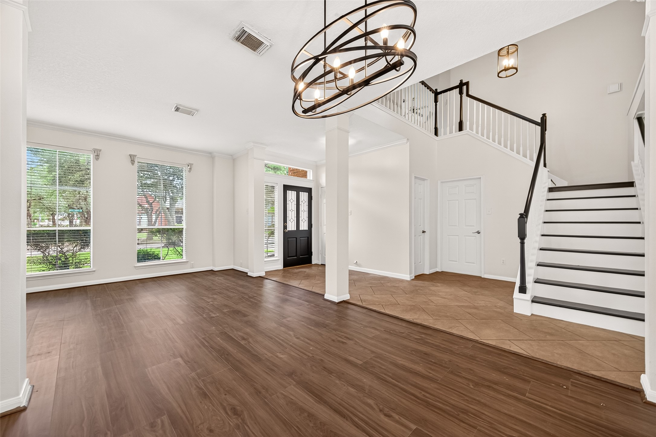 12831 Dove Point Lane Houston, TX 77041 - Photo 12 of 50 a view of empty room with wooden floor and fan