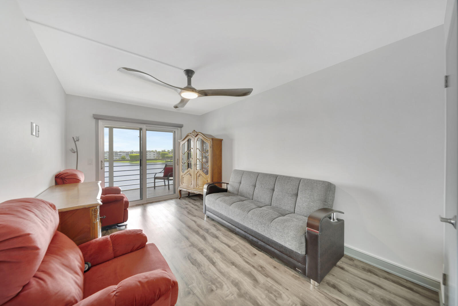 4063 Exeter Boca Raton, FL 33434 - Photo 24 of 55 a living room with furniture and a large window