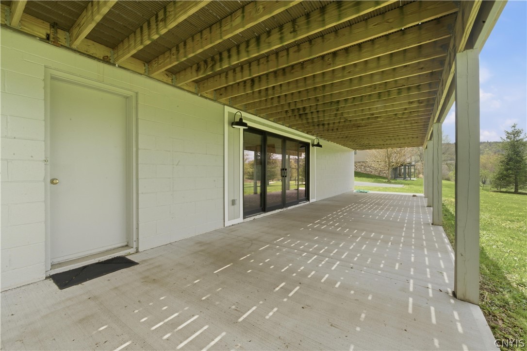 2089 Spring Street Hamilton, NY 13346 - Photo 36 of 38 patio under the deck on the golf course