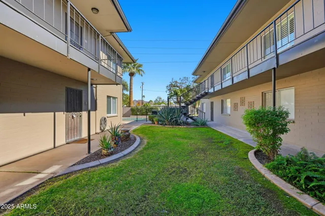 a view of a building with a yard