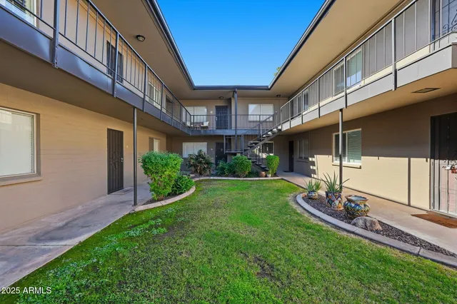 a view of a building with a yard