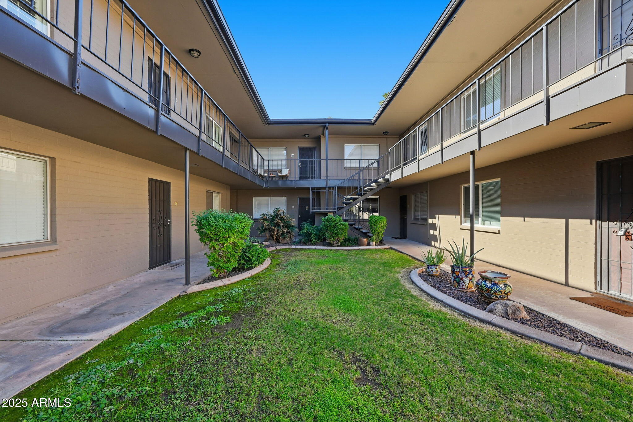 6544 North 12th Street, Unit 19 Phoenix, AZ 85014 - Photo 26 of 44 a view of a building with a yard