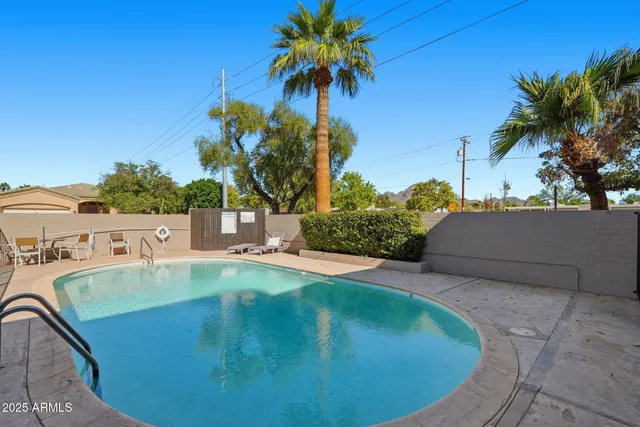 a view of a swimming pool with a slide and a fountain
